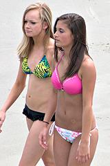 Candid bikini girls along shore